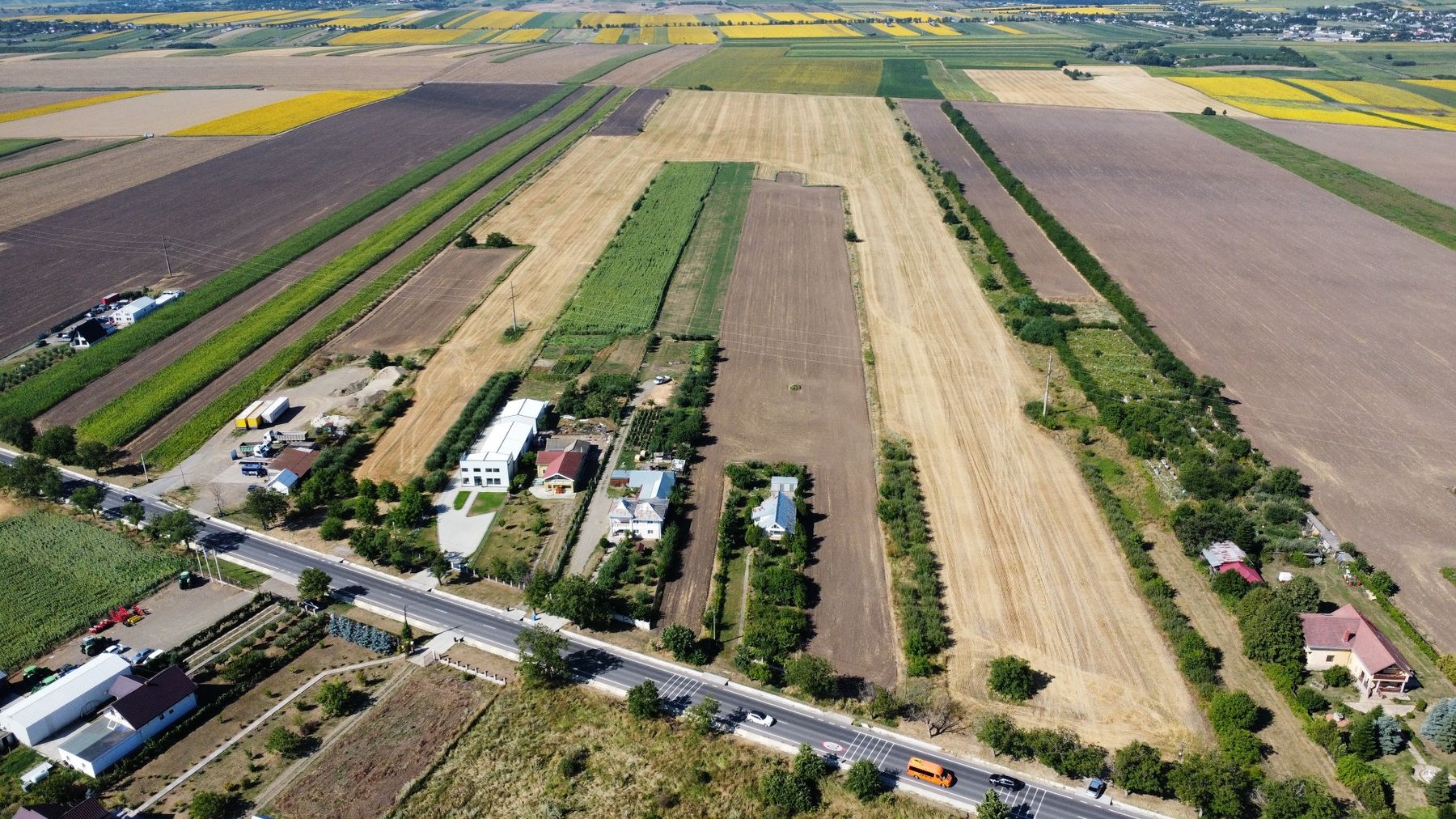 Aerial view of the property rising from European Road E58, with agricultural land extending north